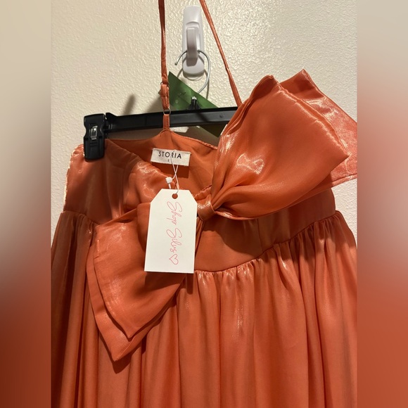 Storia Dresses & Skirts - Storia Coral-Orange Satin Bow Skirt